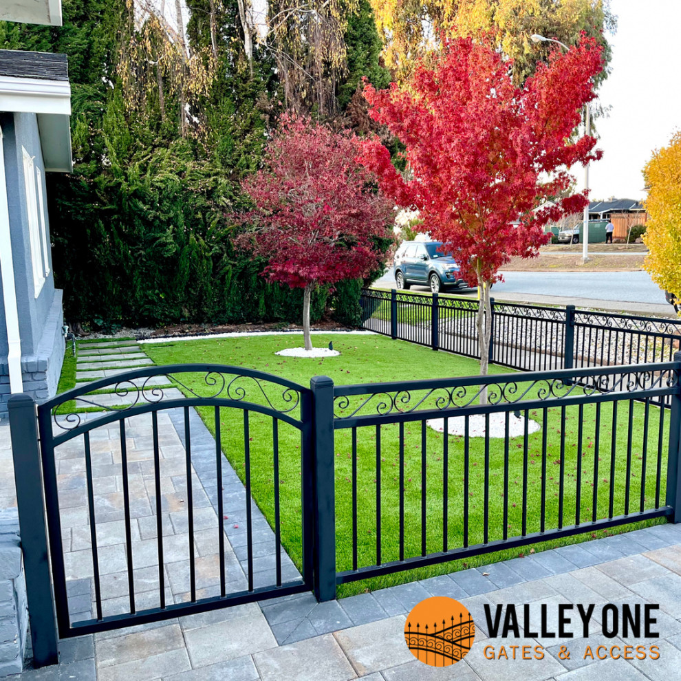 Inspiration for a front yard driveway in San Francisco with with a gate and a metal fence.