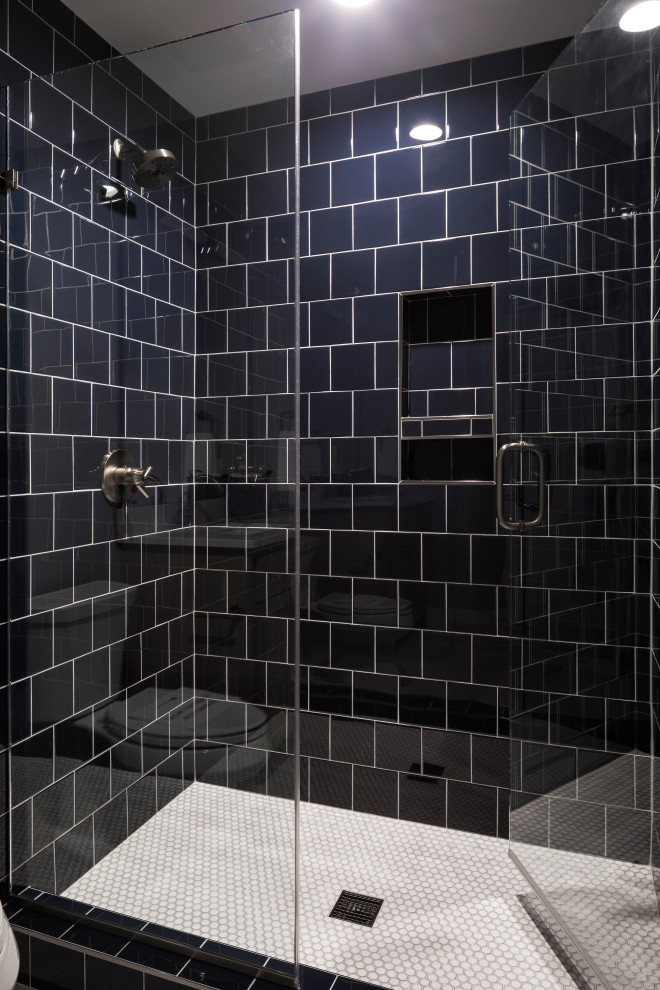 Photo of a large contemporary kids bathroom in Minneapolis with recessed-panel cabinets, brown cabinets, an alcove shower, a one-piece toilet, blue tile, porcelain tile, grey walls, porcelain floors, an undermount sink, marble benchtops, grey floor, a hinged shower door and yellow benchtops.
