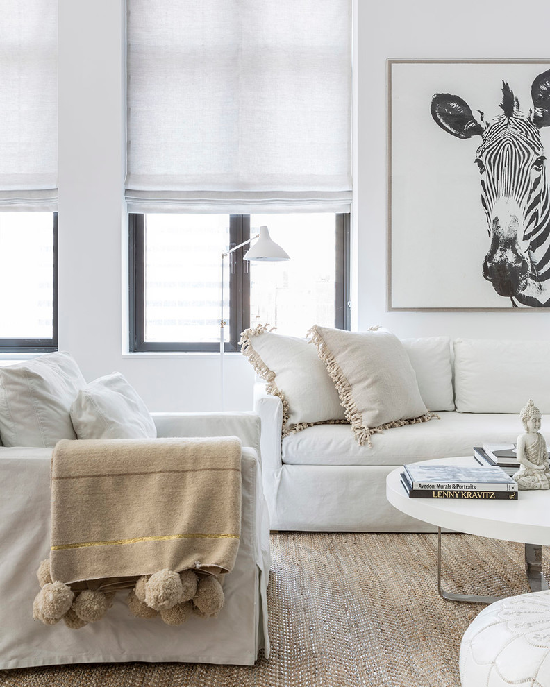 Inspiration for a transitional living room in New York with white walls.