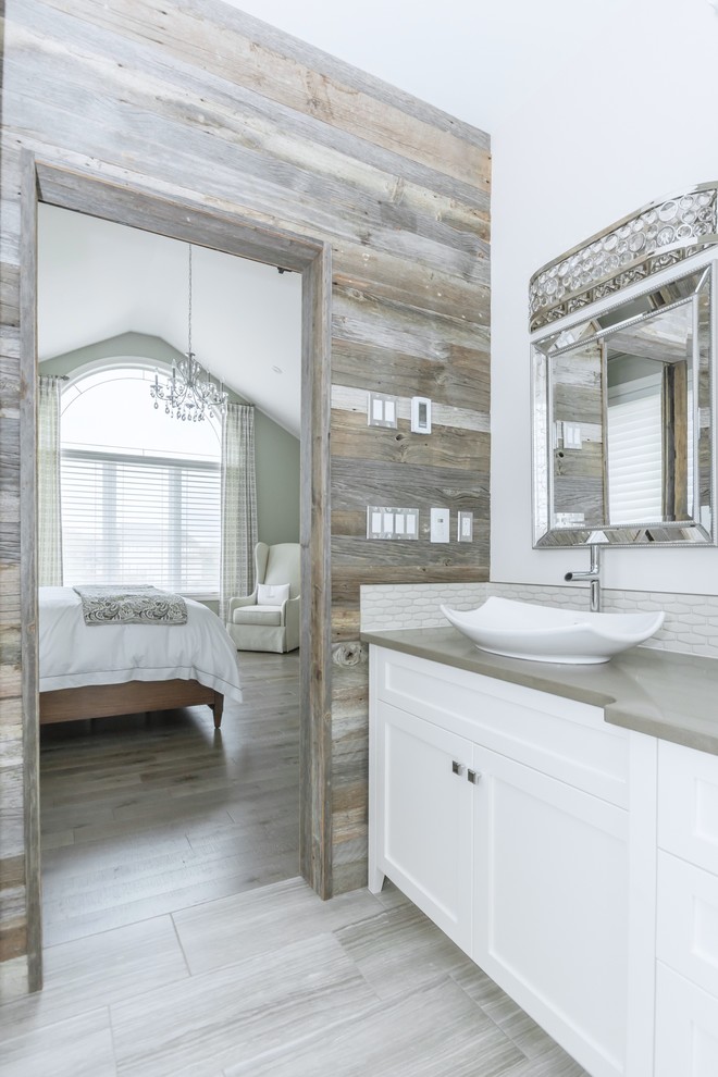 Large transitional master gray tile and ceramic tile porcelain tile freestanding bathtub photo in Toronto with a vessel sink, white cabinets, quartz countertops and white walls