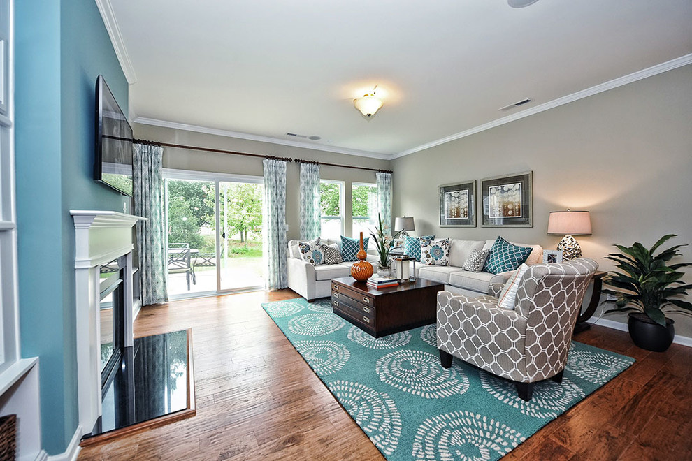 This is an example of a transitional family room in Charlotte.