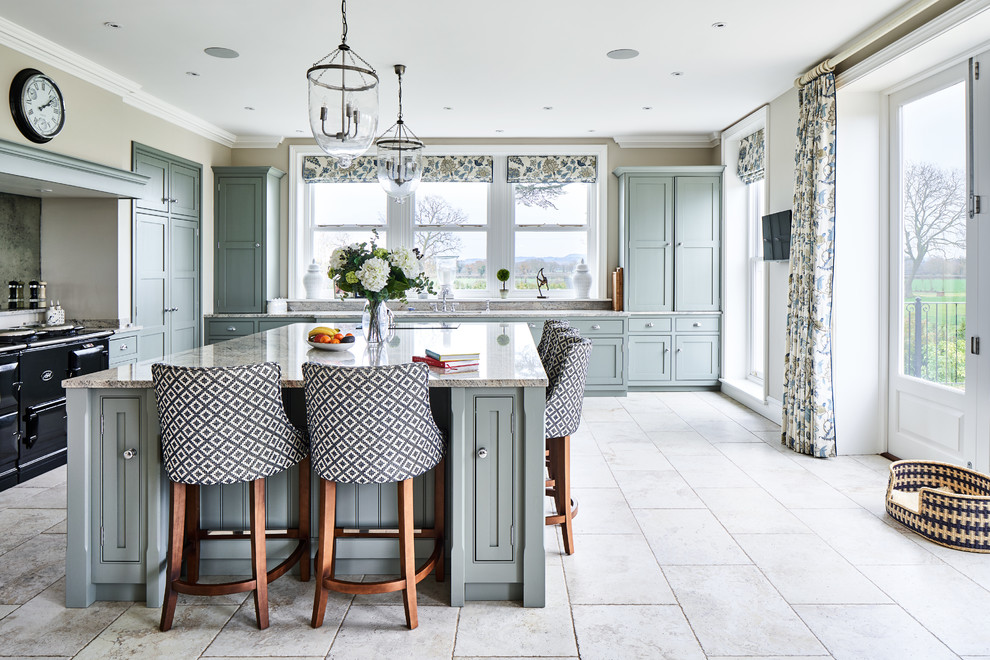 Traditional kitchen in Cheshire with grey cabinets, grey splashback, black appliances, with island, beige floor and grey benchtop.