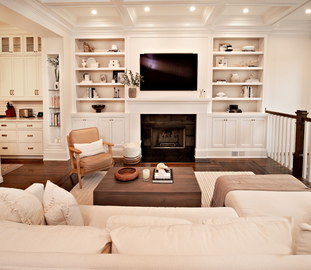 Example of a mid-sized trendy loft-style dark wood floor, brown floor and coffered ceiling family room design in Chicago with white walls, a standard fireplace, a stone fireplace and a wall-mounted tv