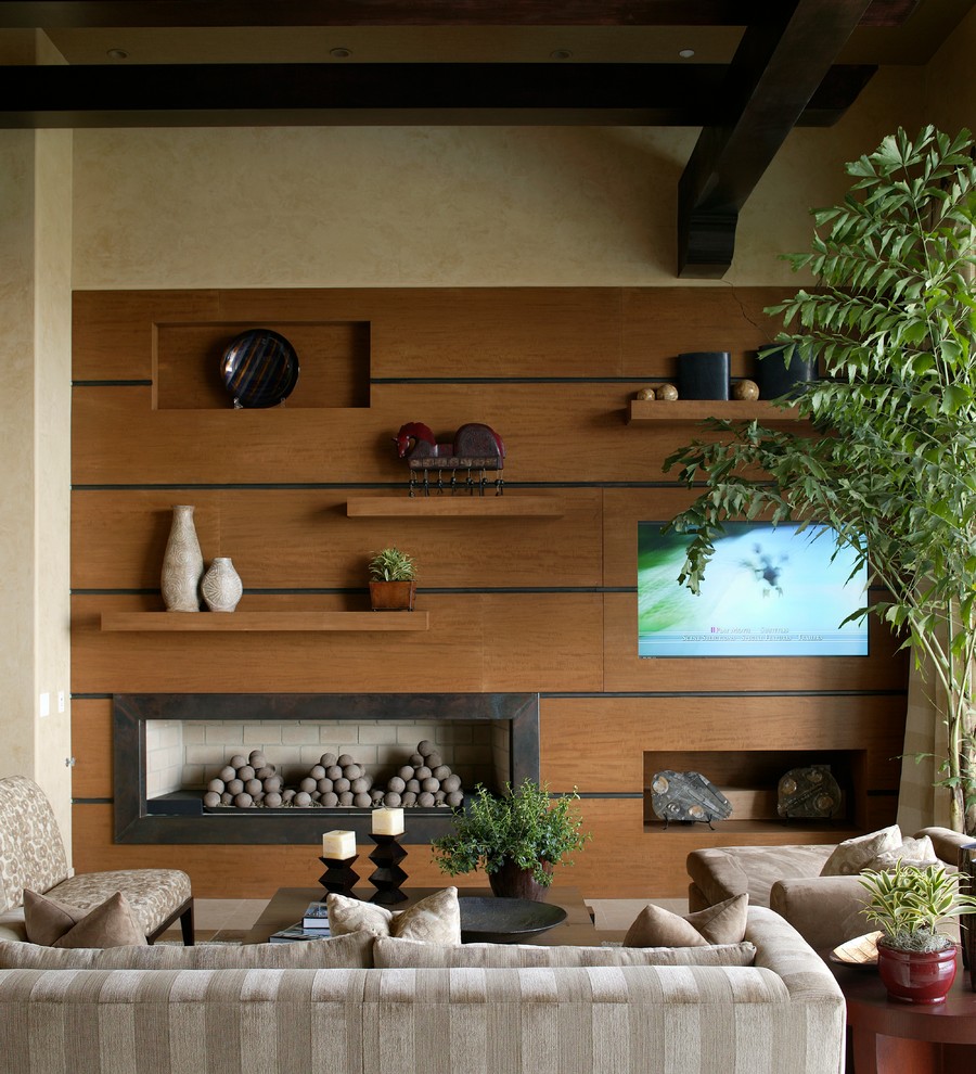 Photo of a contemporary living room in Las Vegas with a ribbon fireplace and a built-in media wall.
