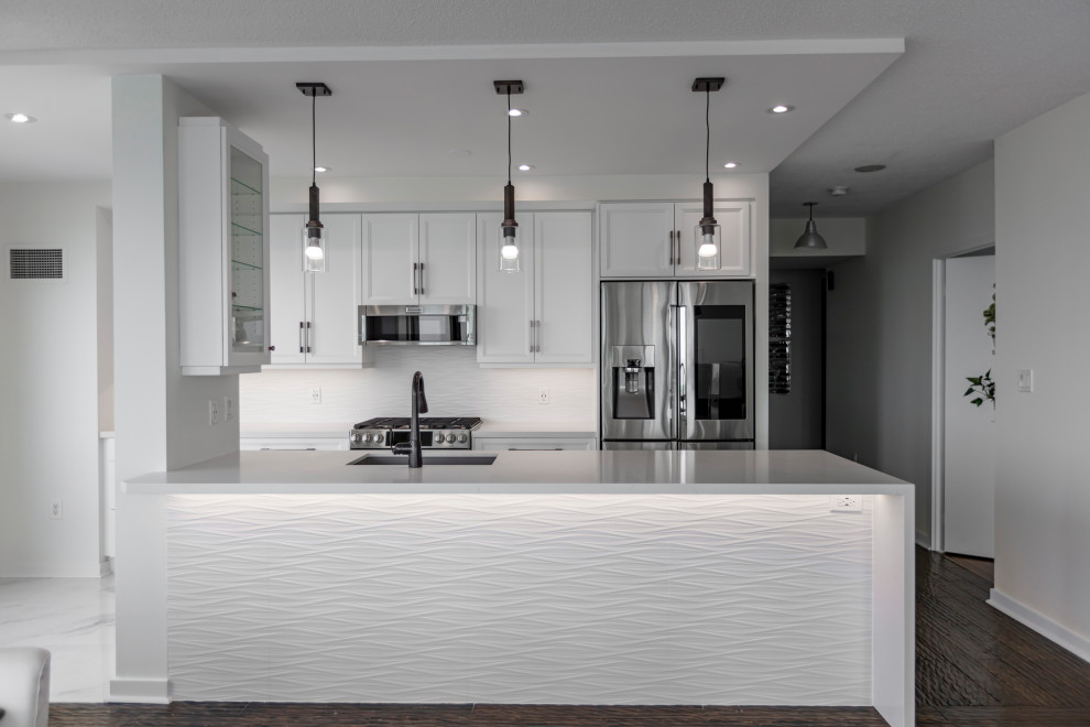 Example of a transitional kitchen design in Toronto