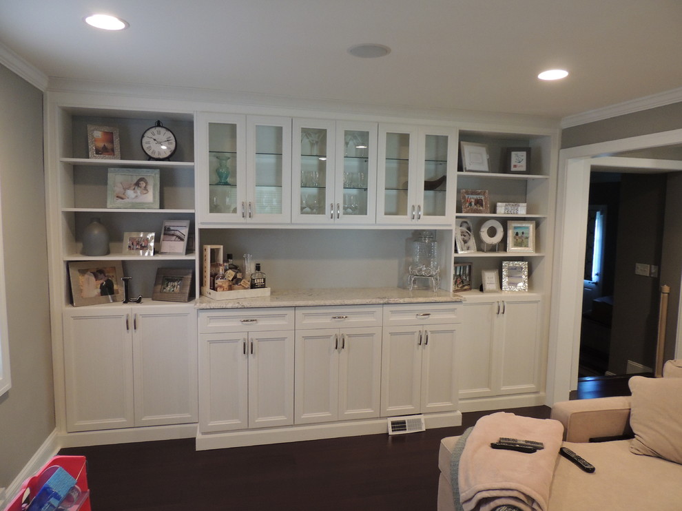 This is an example of a small transitional single-wall bar cart in Philadelphia with shaker cabinets, white cabinets and marble benchtops.