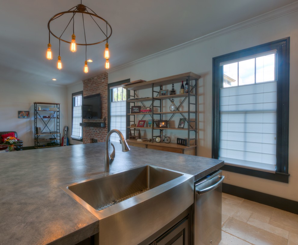 Mid-sized industrial l-shaped open plan kitchen in Orlando with an undermount sink, recessed-panel cabinets, brown cabinets, concrete benchtops, red splashback, brick splashback, stainless steel appliances, ceramic floors, with island and beige floor.