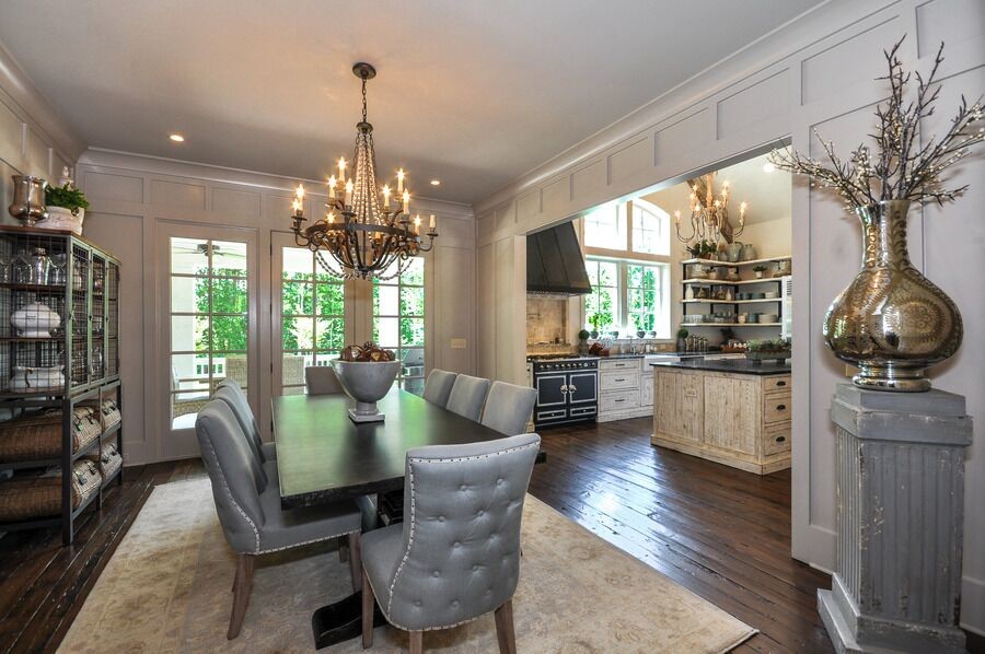 Photo of a country dining room in Atlanta with dark hardwood floors.
