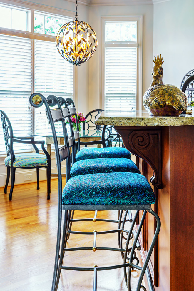 Inspiration for a mid-sized transitional brown floor eat-in kitchen remodel with dark wood cabinets, granite countertops and multicolored countertops