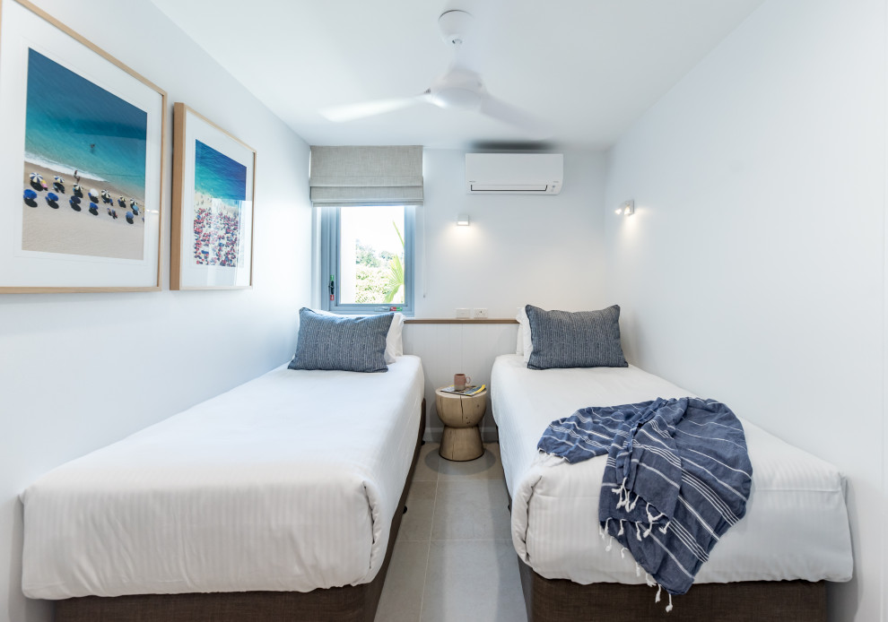 Small beach style guest bedroom photo in Sunshine Coast with white walls