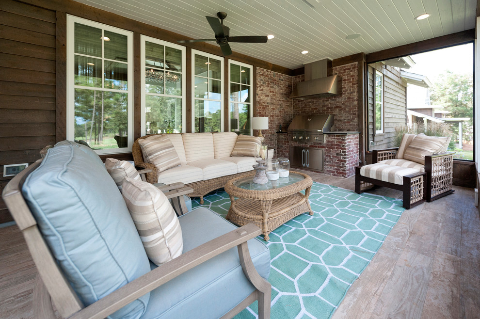 Large traditional backyard screened-in verandah in Houston with a roof extension.