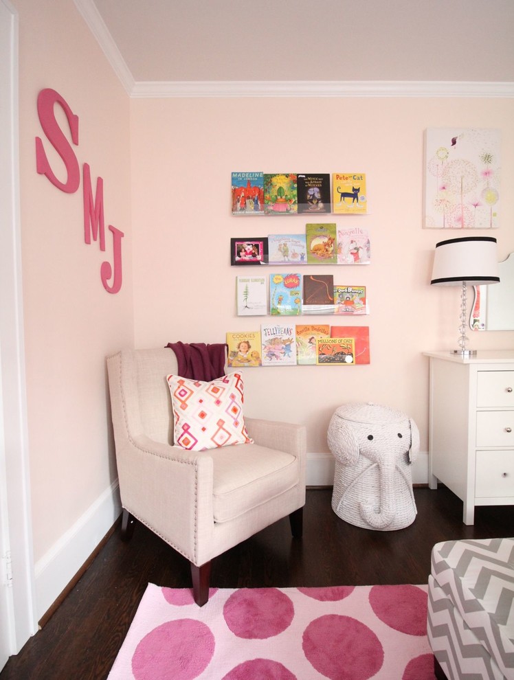 Photo of a mid-sized traditional kids' bedroom for kids 4-10 years old and girls in Atlanta with medium hardwood floors.