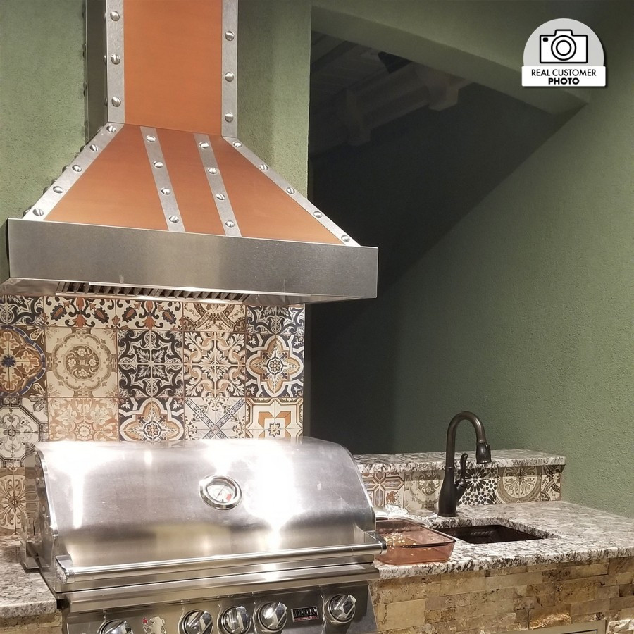 Kitchens featuring a ZLINE Copper Wall Range Hood