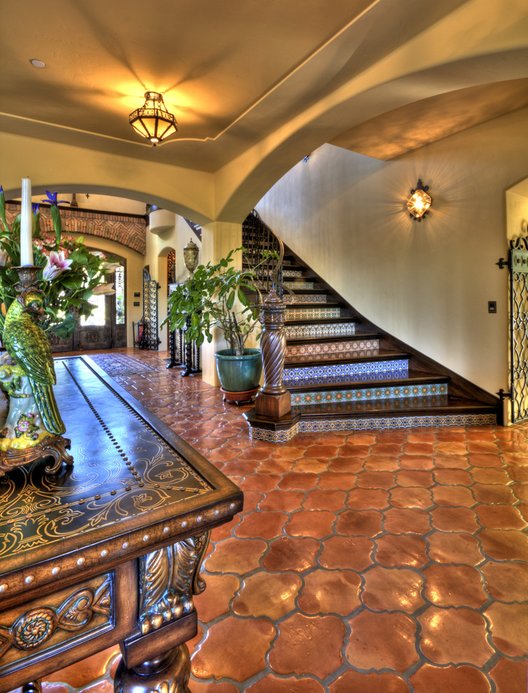 Photo of a mediterranean wood staircase in San Francisco with tile risers.