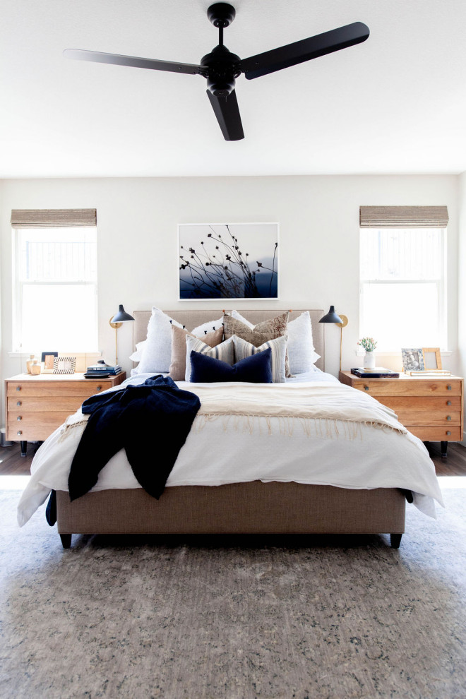 Transitional bedroom in Sacramento with white walls, dark hardwood floors and grey floor.