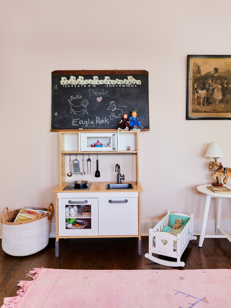 Eclectic children’s room in Los Angeles with pink walls.