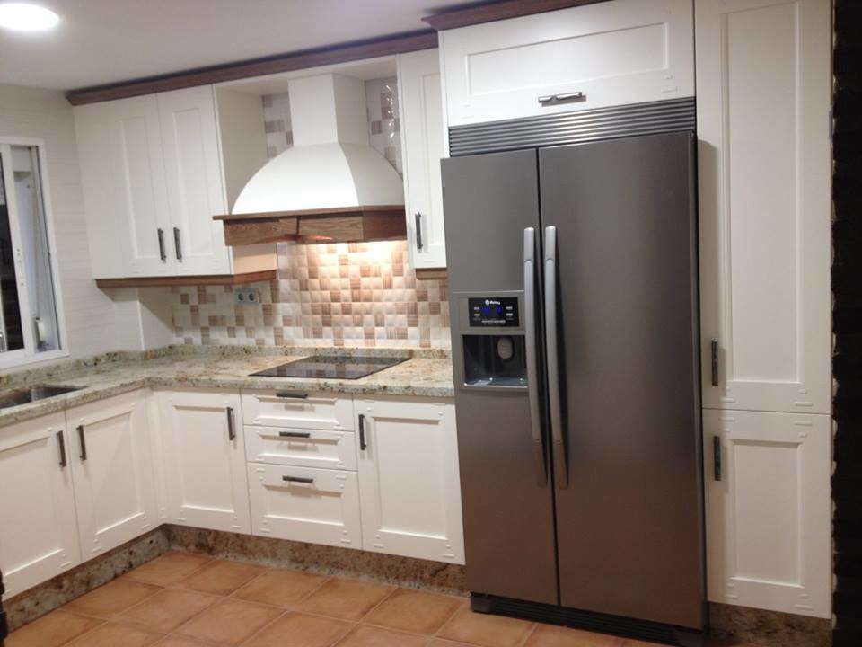 This is an example of a small transitional l-shaped separate kitchen in Other with an undermount sink, granite benchtops, stainless steel appliances, ceramic floors and no island.
