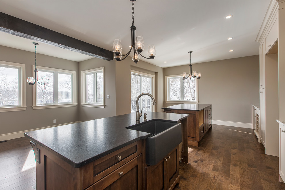 Example of a large transitional single-wall open concept kitchen design with shaker cabinets, beige cabinets, granite countertops, white backsplash, an island and multicolored countertops