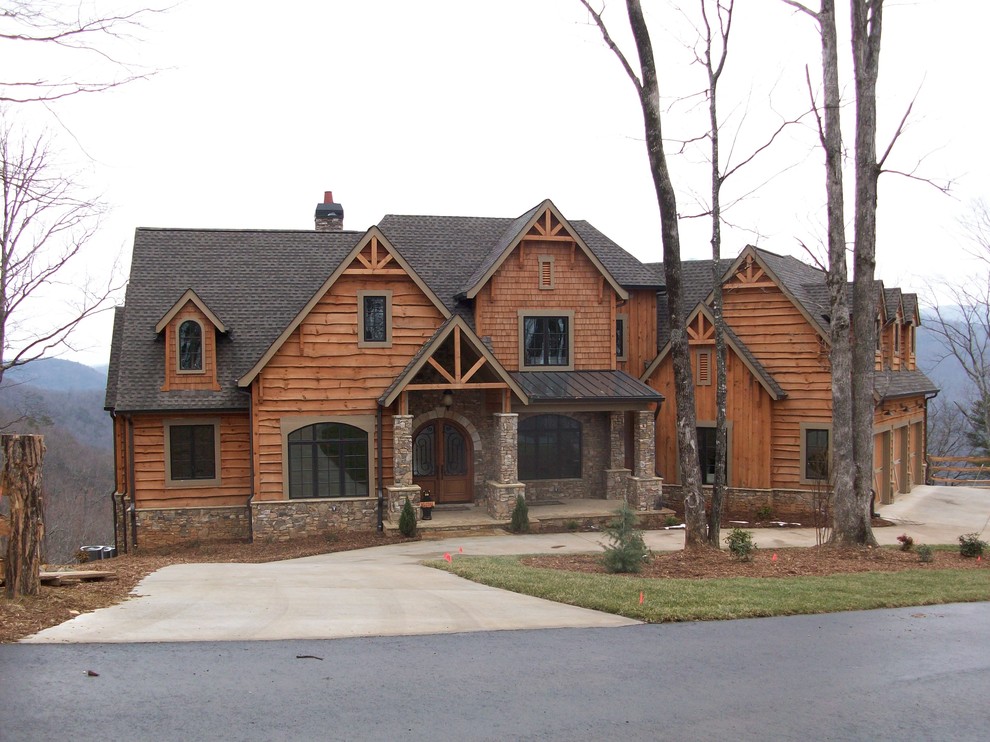 This is an example of a large traditional two-storey brick brown exterior in Atlanta with a gable roof.