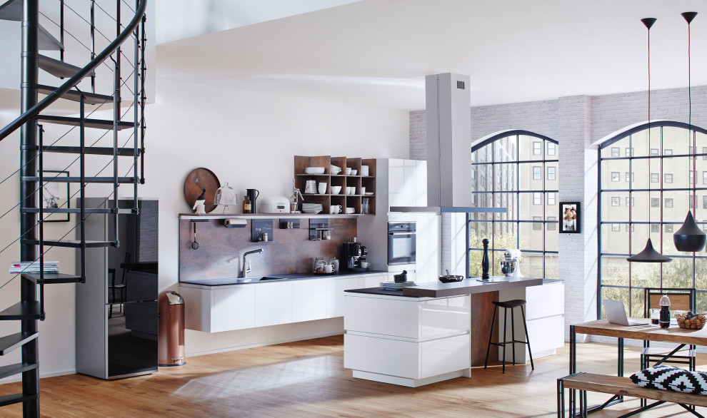 Photo of a mid-sized contemporary single-wall eat-in kitchen in Other with an integrated sink, flat-panel cabinets, white cabinets, quartz benchtops, brown splashback, timber splashback, black appliances, dark hardwood floors, with island, brown floor and black benchtop.