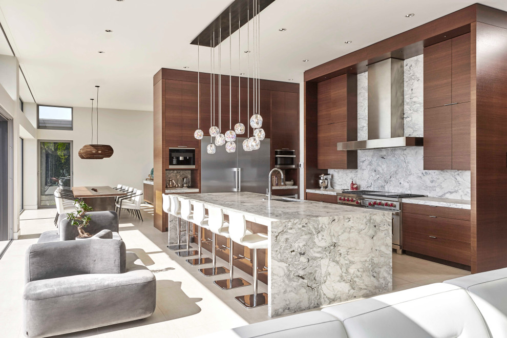 Inspiration for a large contemporary l-shaped eat-in kitchen in Seattle with an undermount sink, flat-panel cabinets, dark wood cabinets, marble benchtops, grey splashback, stone slab splashback, stainless steel appliances, porcelain floors, with island, white floor and grey benchtop.