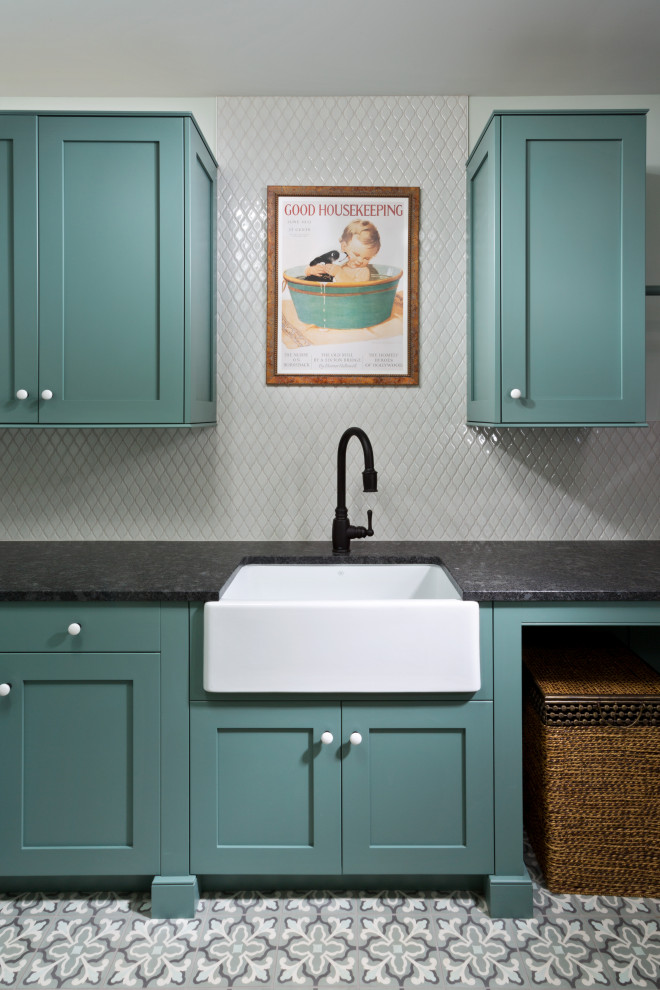 This is an example of a small classic single-wall separated utility room in New York with a belfast sink, shaker cabinets, turquoise cabinets, granite worktops, white splashback, mosaic tiled splashback, white walls, vinyl flooring, multi-coloured floors and black worktops.