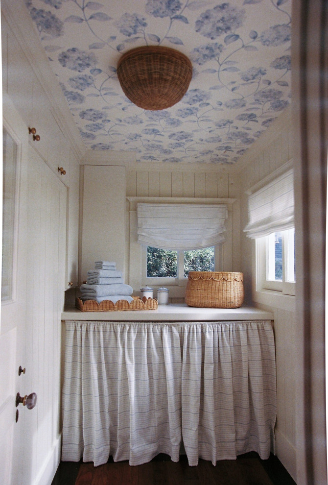 Inspiration for a mid-sized timeless single-wall wallpaper ceiling and shiplap wall dedicated laundry room remodel in Los Angeles with white cabinets, shiplap backsplash and a side-by-side washer/dryer