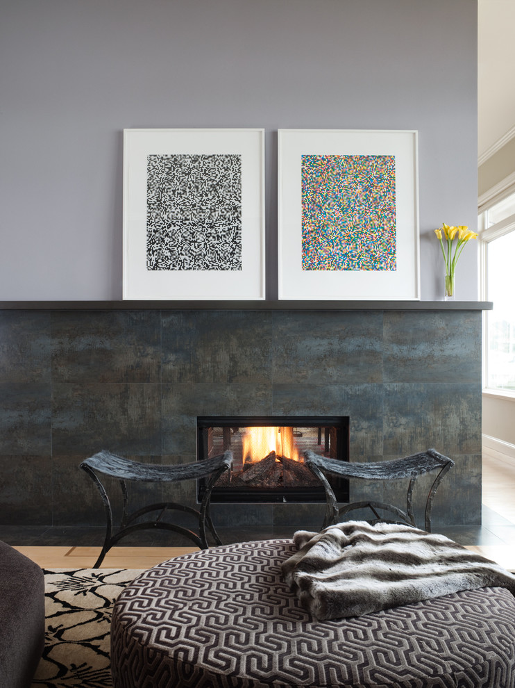 This is an example of a contemporary living room in San Francisco with a two-sided fireplace.