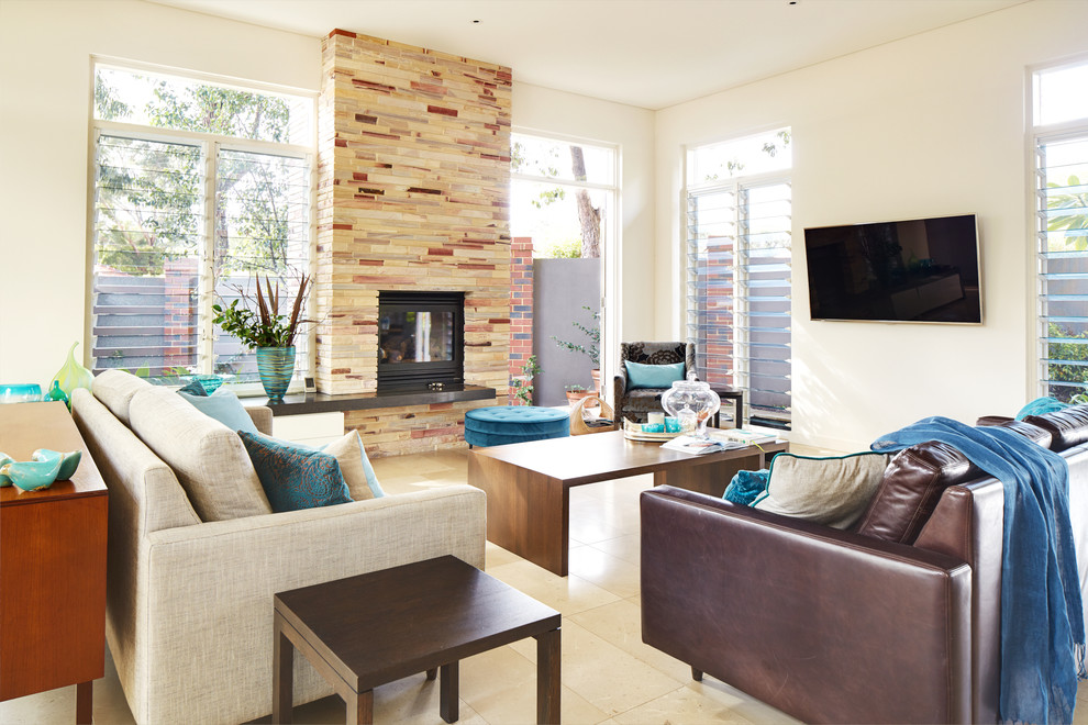 This is an example of a contemporary enclosed family room in Sunshine Coast with white walls, a standard fireplace, a stone fireplace surround and a wall-mounted tv.