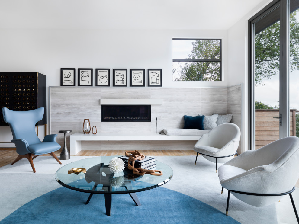 Photo of a mid-sized contemporary formal open concept living room in San Francisco with white walls and light hardwood floors.