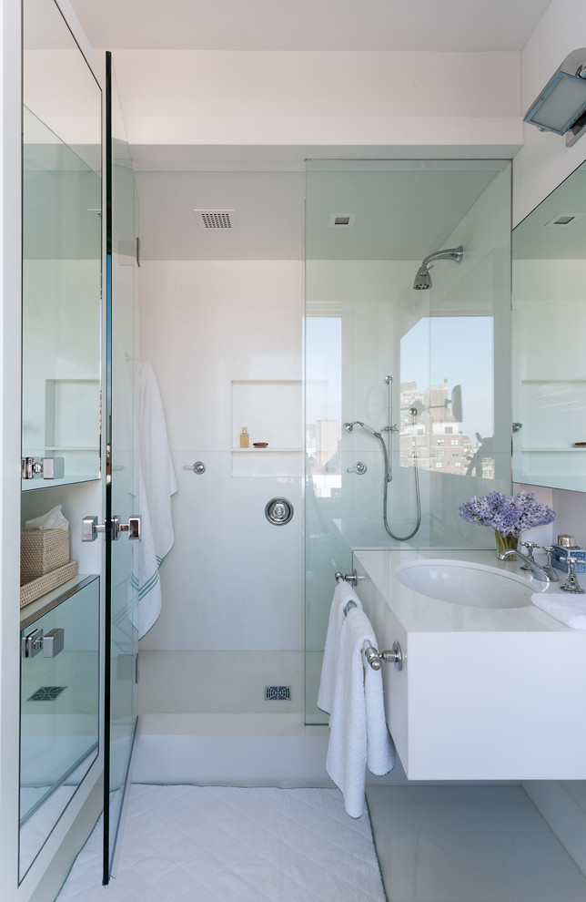 This is an example of a contemporary bathroom in New York with an undermount sink and a niche.
