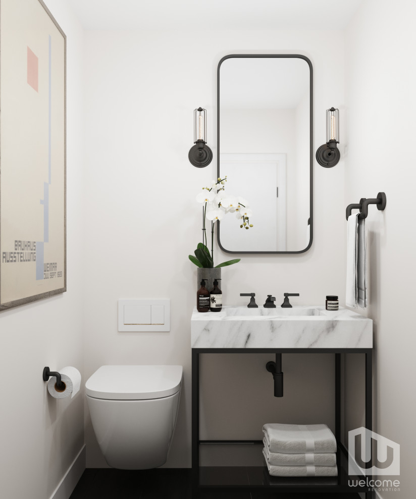 Idée de décoration pour un petit WC suspendu urbain avec un placard sans porte, des portes de placard noires, un carrelage blanc, une vasque, un plan de toilette en marbre, un plan de toilette blanc et meuble-lavabo sur pied.