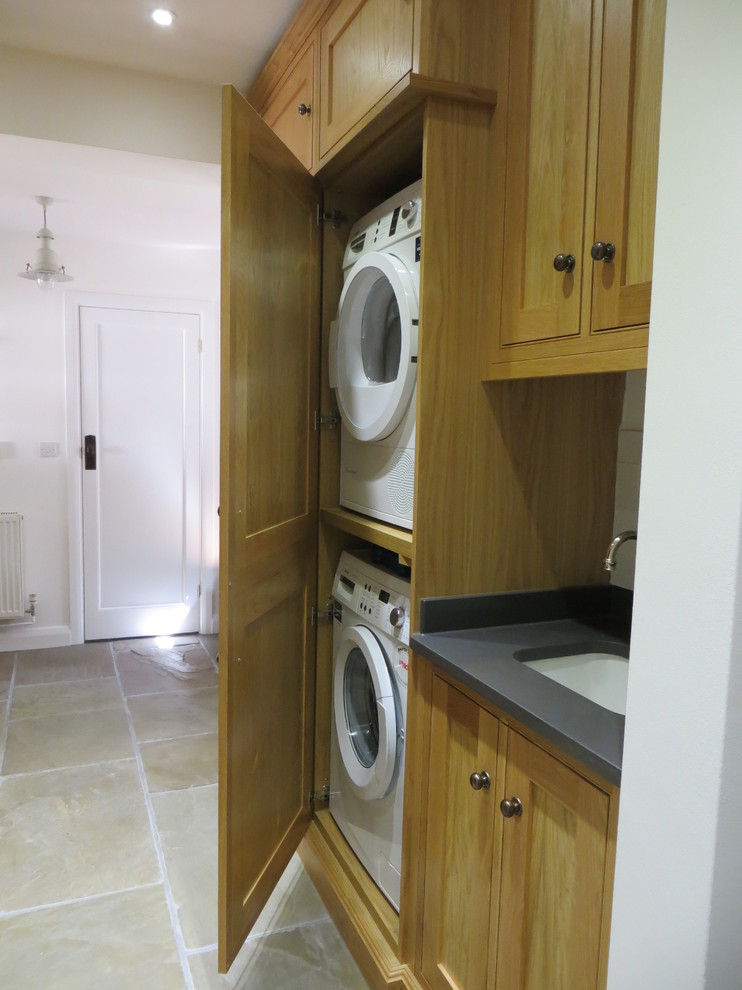 Design ideas for a traditional laundry room in Surrey.
