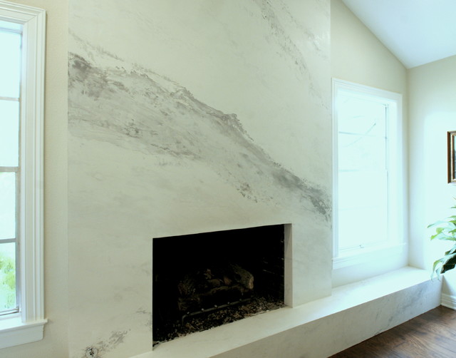 A dated brick fireplace is faced with sheetrock and then given a Venetian plaster finish to imitate Calacutta Gold marble