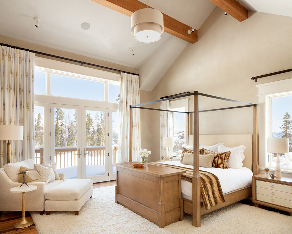 Inspiration for a mid-sized transitional master bedroom in Salt Lake City with beige walls, no fireplace and medium hardwood floors.