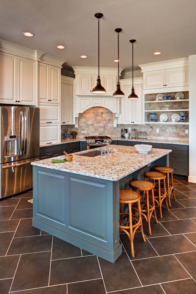 Design ideas for a traditional kitchen in Salt Lake City with an undermount sink, raised-panel cabinets, white cabinets, beige splashback and stainless steel appliances.