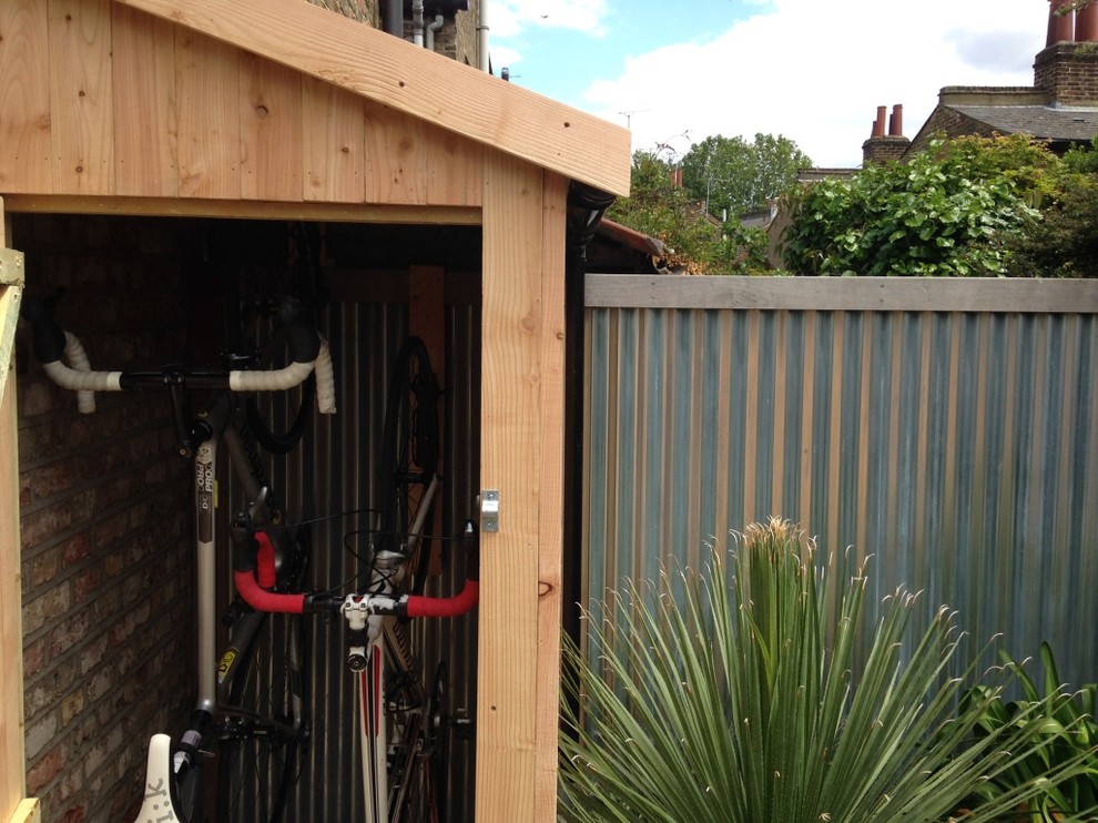 Photo of a small contemporary attached garden shed in London.