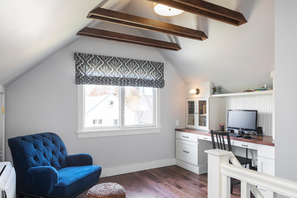 Inspiration for a transitional built-in desk dark wood floor home office remodel in Seattle with gray walls