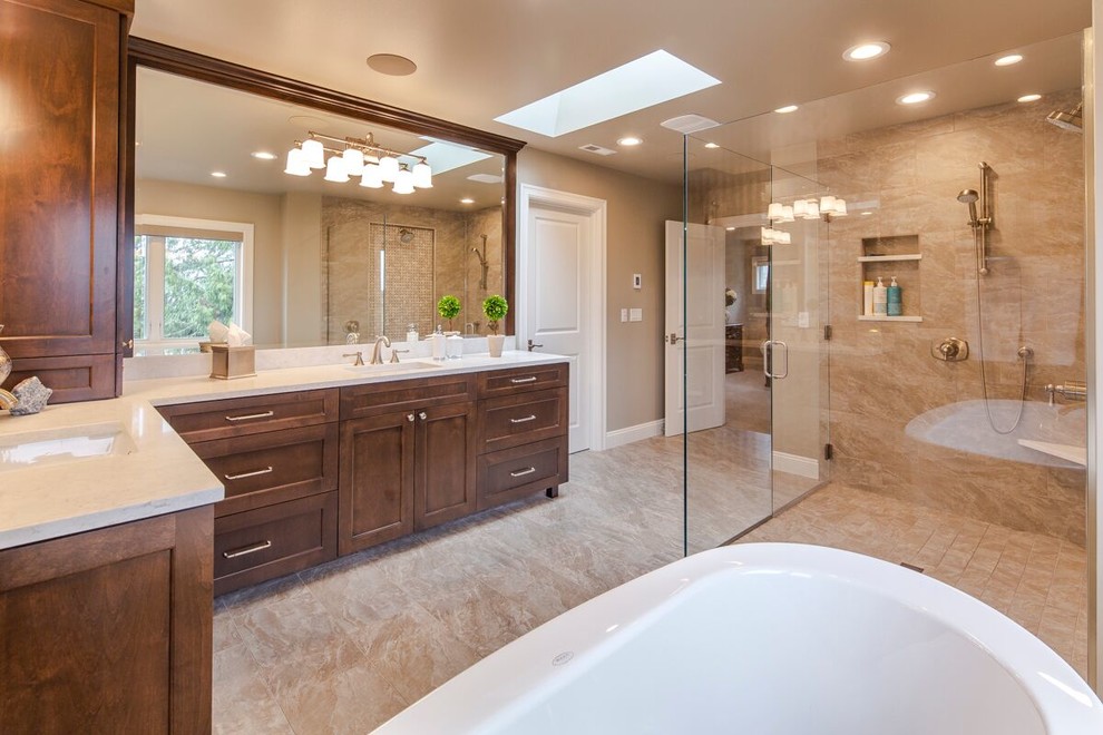 Freestanding bathtub - large transitional master brown tile and porcelain tile porcelain tile and beige floor freestanding bathtub idea in Seattle with shaker cabinets, dark wood cabinets, a one-piece toilet, brown walls, an undermount sink, quartzite countertops, a hinged shower door and white countertops