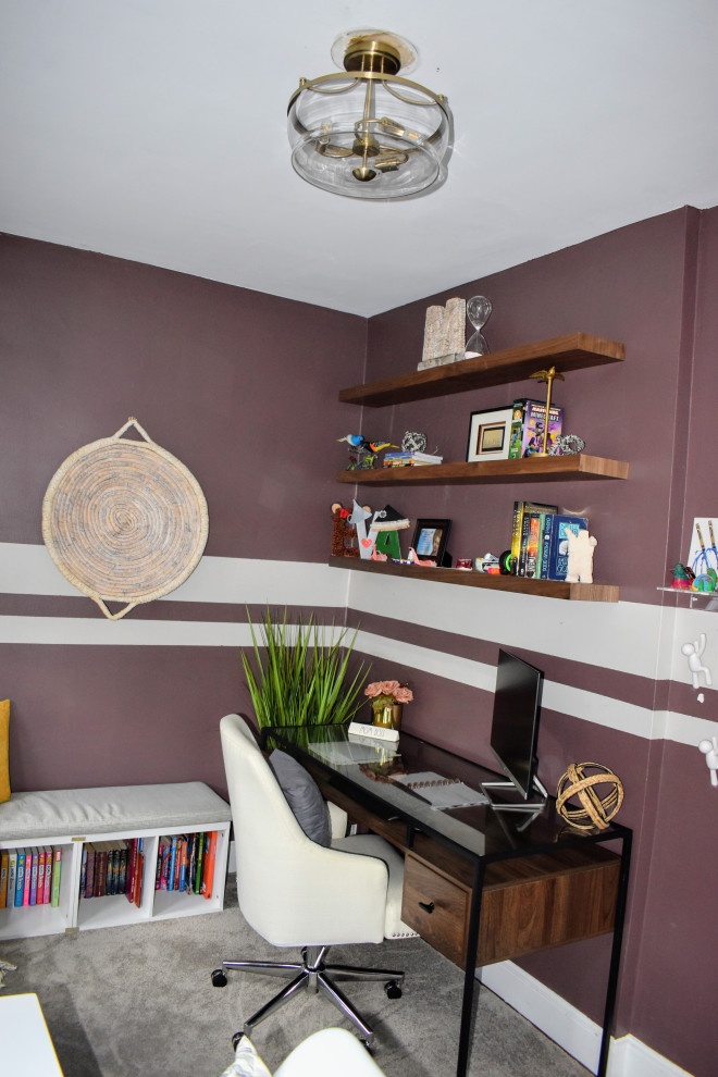 Mid-sized modern study room in New York with purple walls, brick floors, no fireplace, a freestanding desk and grey floor.