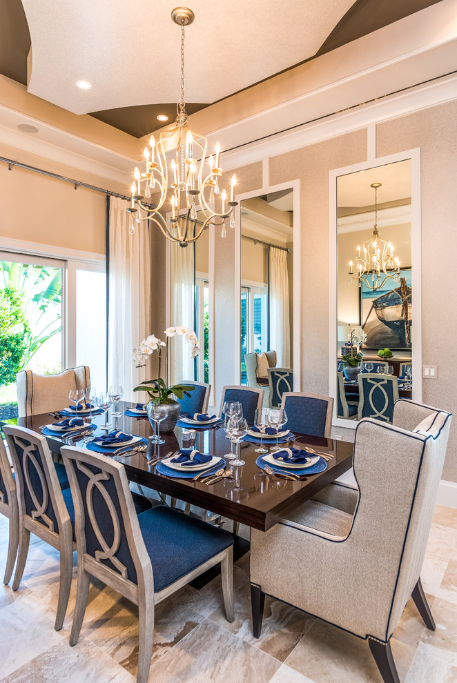 Inspiration for an expansive transitional separate dining room in Miami with beige walls and marble floors.