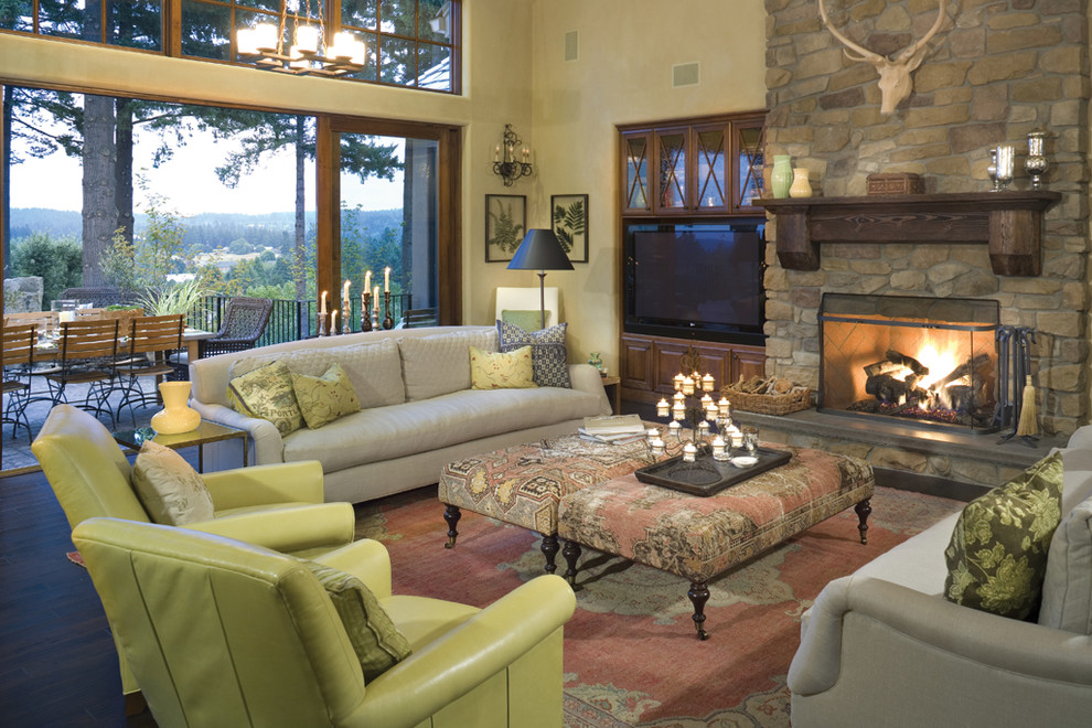 Traditional living room in Portland with a stone fireplace surround.