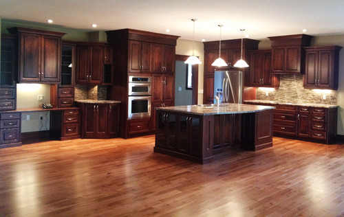 love the color of the floor with the cherry cabinets. what ...