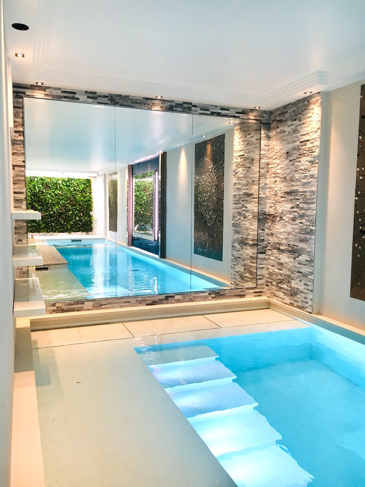 Inspiration for a contemporary indoor rectangular pool in Paris.