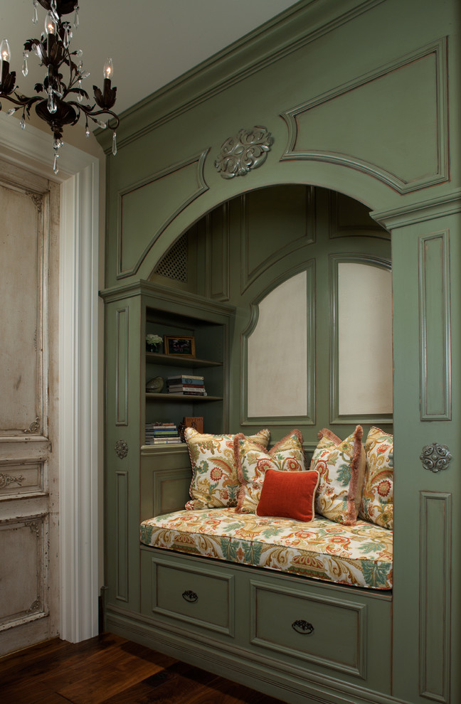 This is an example of a traditional family room in Other with green walls.