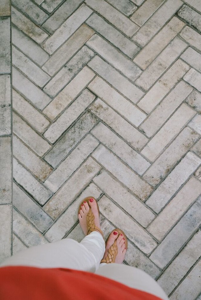 Inspiration for a mid-sized ceramic tile and gray floor mudroom remodel