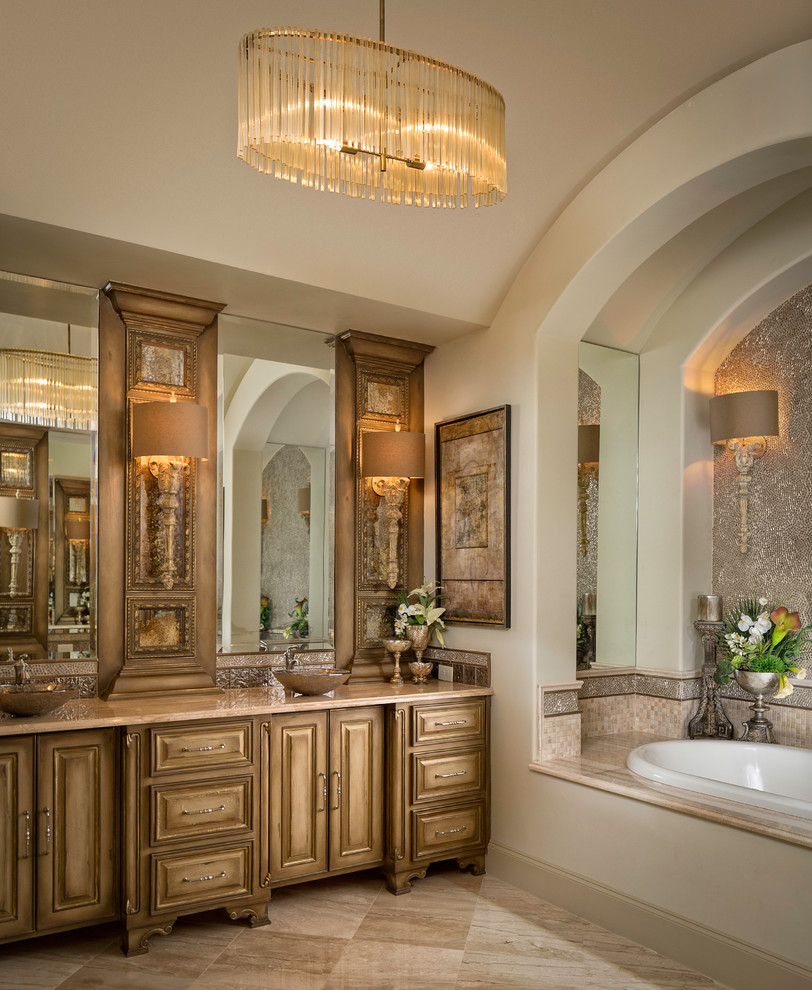 Design ideas for a mid-sized master bathroom in Dallas with shaker cabinets, distressed cabinets, a drop-in tub, a double shower, a two-piece toilet, gray tile, metal tile, beige walls, porcelain floors, a vessel sink, engineered quartz benchtops, beige floor, an open shower and beige benchtops.