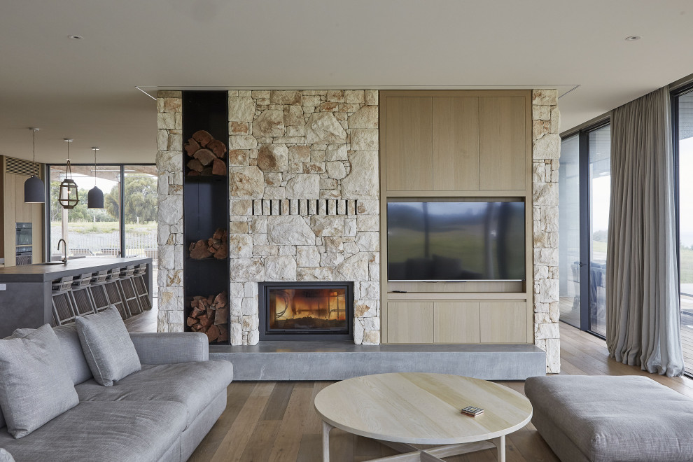 This is an example of a beach style family room in Melbourne.