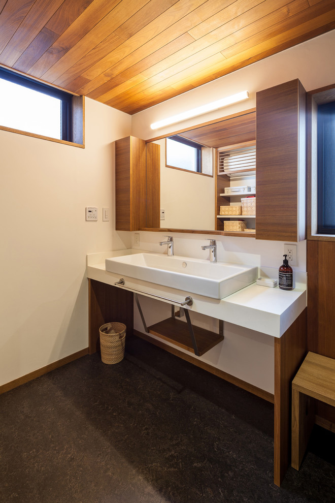 Photo of a contemporary powder room in Osaka with white walls and linoleum floors.