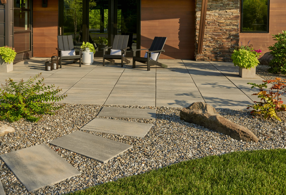 Inspiration for a modern backyard formal garden in Philadelphia with with path and concrete pavers.